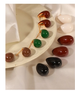 Detailed view of teardrop enamel earrings with 18k gold plating in multiple colors