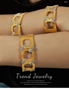 Macro view of gold hammered texture cuff bracelet with sparkling zircon inlays