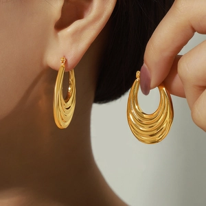French vintage crescent moon hoop earrings with tiered gold texture and metal finish