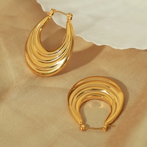 Polished gold-plated horseshoe hoop earrings in a minimalist multilayered crescent design