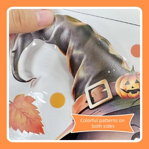 Detail of Halloween window sticker showing double-sided printing with pumpkin and witch hat