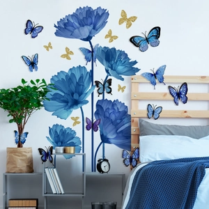 Detail of 3D blue floral wall stickers and golden butterflies on a white bedroom wall