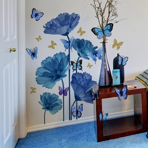 Blue 3D butterfly and floral wall stickers set on white wall with modern home decor
