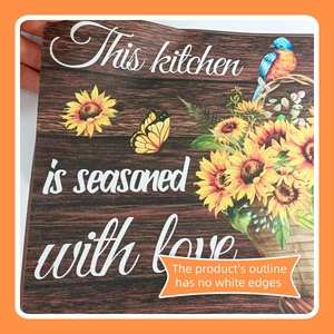 Detail of sunflower kitchen wall decal with This kitchen is seasoned with love text