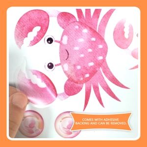 Detail of pink crab sticker showing the easy peel adhesive backing for kids wall decor