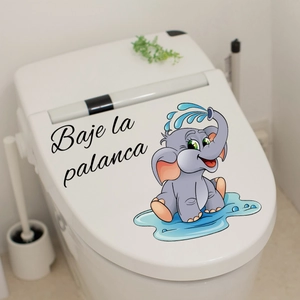 Detail of cartoon elephant sticker with Spanish Baje la palanca text on toilet lid