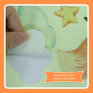 Detail showing the adhesive backing of glow-in-the-dark star and cloud wall stickers