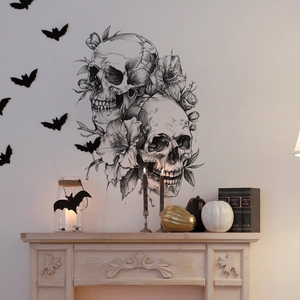 Gothic skull and flower wall decal above a fireplace with Halloween pumpkin decor