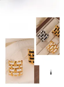 Close-up of vintage woven grid rings with 18k gold plating and colorful enamel inlay