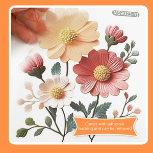Detail of pink floral wall sticker being peeled to show adhesive and transparency