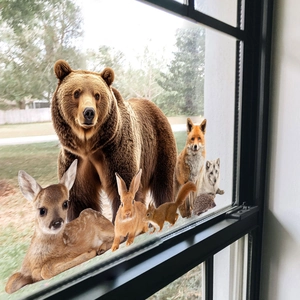 Realistic forest animal window stickers featuring bear, deer, and fox on glass surface