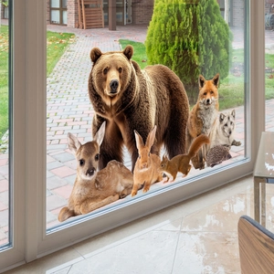Realistic forest animal window clings showing 3D deer and fox peering through glass