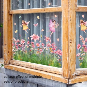 Detailed view of pink floral and fairy window stickers on glass with white curtains