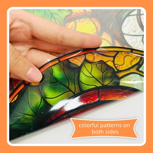 Close-up of double-sided autumn pumpkin leaves static window stickers with colorful patterns