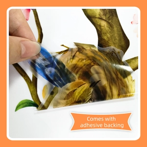 Detail of self-adhesive backing on peach blossom and bird PVC wall stickers