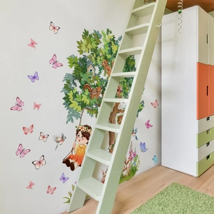 Cartoon wall decal with a large tree, girl on a swing and squirrels for kids room decor