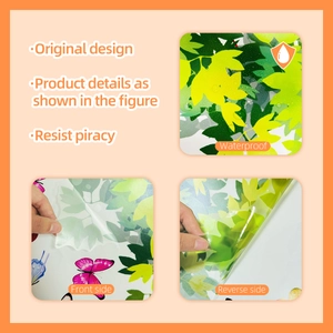 Close-up of waterproof cartoon wall stickers showing green leaves and colorful butterflies