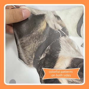 Close-up of double-sided colorful dog pattern print on a flexible pet cone collar