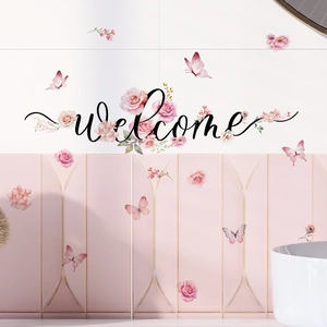 Detail of self-adhesive floral welcome wall sticker with pink roses and butterflies