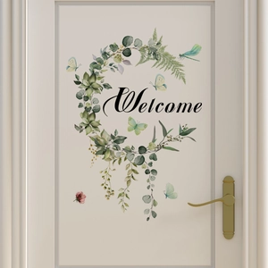 Floral Welcome door sticker with green leaves and blue butterflies on a white door