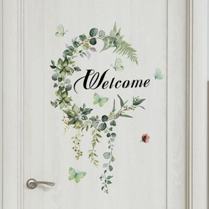 Floral Welcome door sticker with green leaves and butterflies on a white wooden door