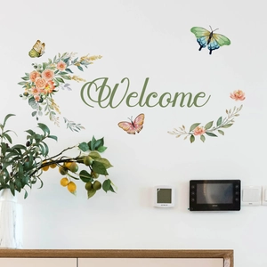 Detail of Welcome wall decal with watercolor floral patterns and vibrant butterflies