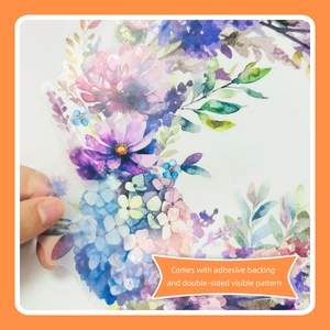 Detail of floral wall sticker showing the adhesive backing and double-sided pattern