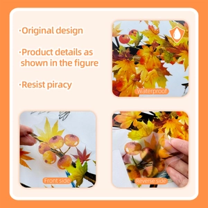 Detailed view of waterproof autumn leaf wall decals with double-sided orange maple design