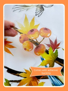 Close-up of autumn watercolor bird stickers showing the transparent adhesive PET material