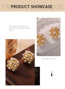 Detailed view of square gold woven earrings featuring embedded white high-luster pearls