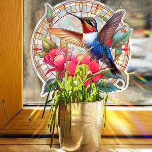Détail d'autocollant colibri et fleurs style vitrail avec reflets de lumière naturelle