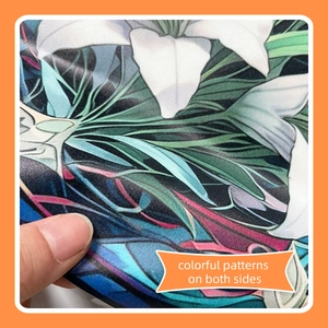 Detailed close-up showing lily flower prints on both sides of the static window sticker