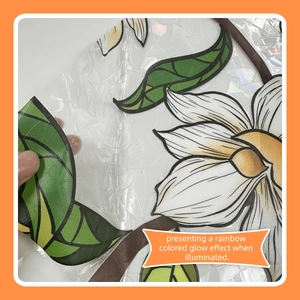 Macro detail of 3D prism static glass film with hand-drawn white flowers and green leaves