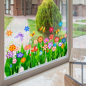 Floral and butterfly static window cling decals on glass with outdoor garden background