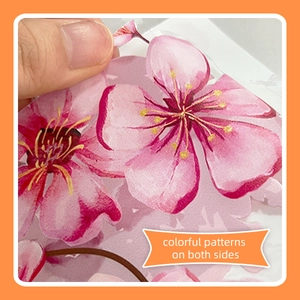 Detail of double-sided cherry blossom window sticker with vibrant floral watercolor print