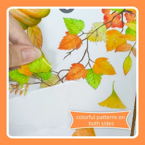 Close-up showing transparent double-sided autumn leaf window stickers with colorful patterns