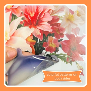 Detail showing colorful double-sided floral patterns on a removable glass window static cling