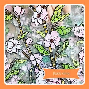 Macro detail of pink floral static cling window sticker with green leaf patterns