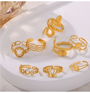 Detailed set of 7 gold titanium steel rings featuring crown, heart, and geometric patterns