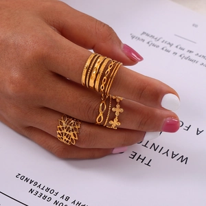 Stackable gold geometric ring set with hollow textured designs for a minimalist look