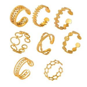 Set of eight gold-plated titanium steel rings featuring hollow cutout and chain designs