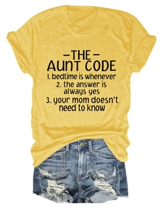 Close-up of yellow cotton t-shirt fabric texture and The Aunt Code printed text design