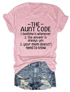 Flat lay of pink cotton T-shirt with black text and frayed blue denim shorts set