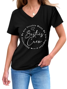 Detail of V-neck cotton T-shirt featuring a white Besties Crew graphic print on black fabric