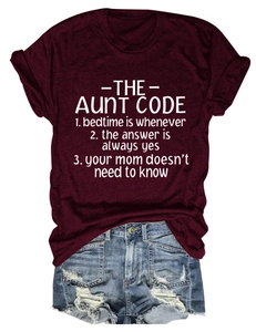 Detailed view of the burgundy T-shirt showing The Aunt Code slogan and soft cotton fabric