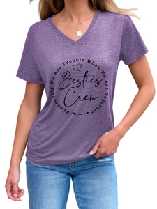 Detail of purple V-neck T-shirt showing the black Besties Crew slogan print on soft fabric