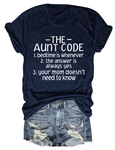 Flat lay of navy crew neck t-shirt with text paired with distressed denim shorts
