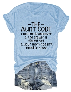 Flat lay of light blue Aunt Code cotton T-shirt paired with distressed denim shorts