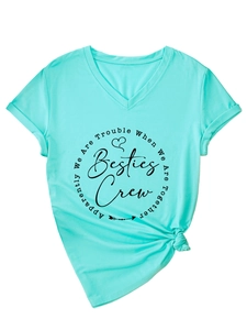 Detail of mint green V-neck T-shirt with black Besties Crew graphic print and side knot