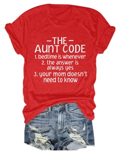 Flat lay of red casual cotton t-shirt with white lettering and distressed denim shorts